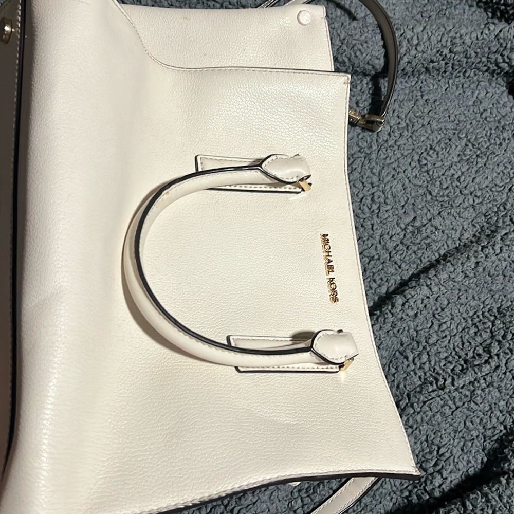 Cream color Michael Kors purse. Used a handful of times.